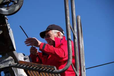 Jim hooks up the cable to the camera box